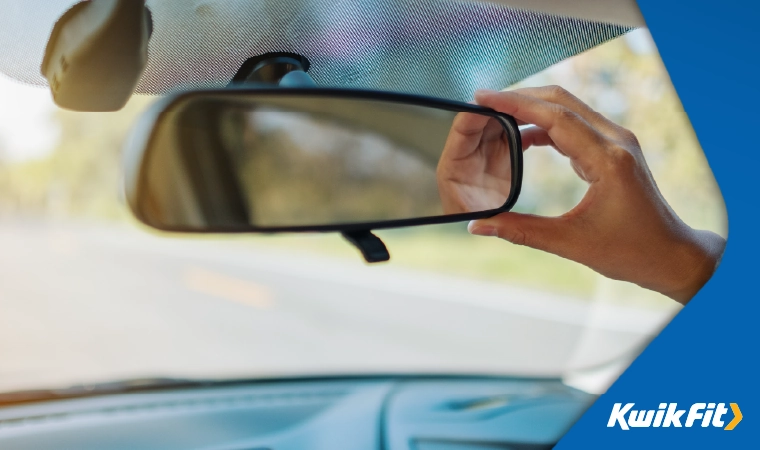 adjusting the rear view mirror